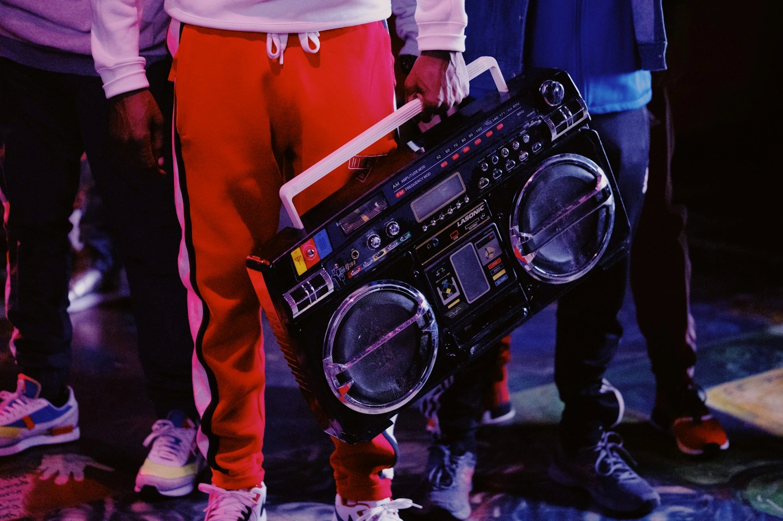 Friends holding a boombox, street style energy
