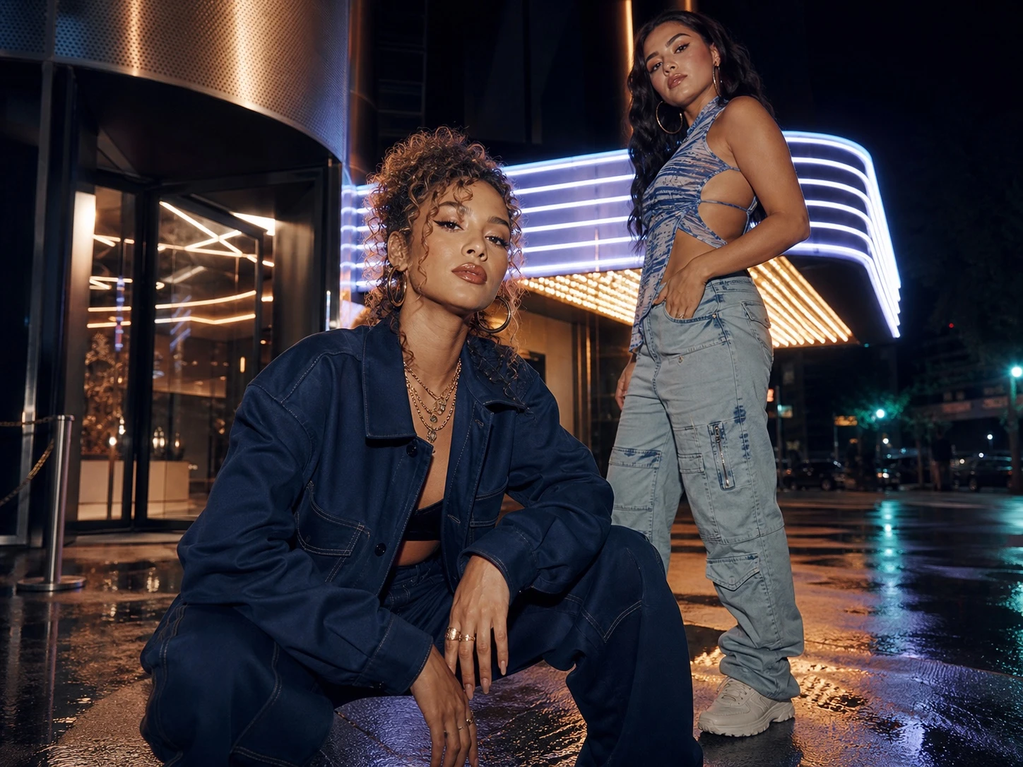 Two Latina hip-hop artists outside a Mexico City venue