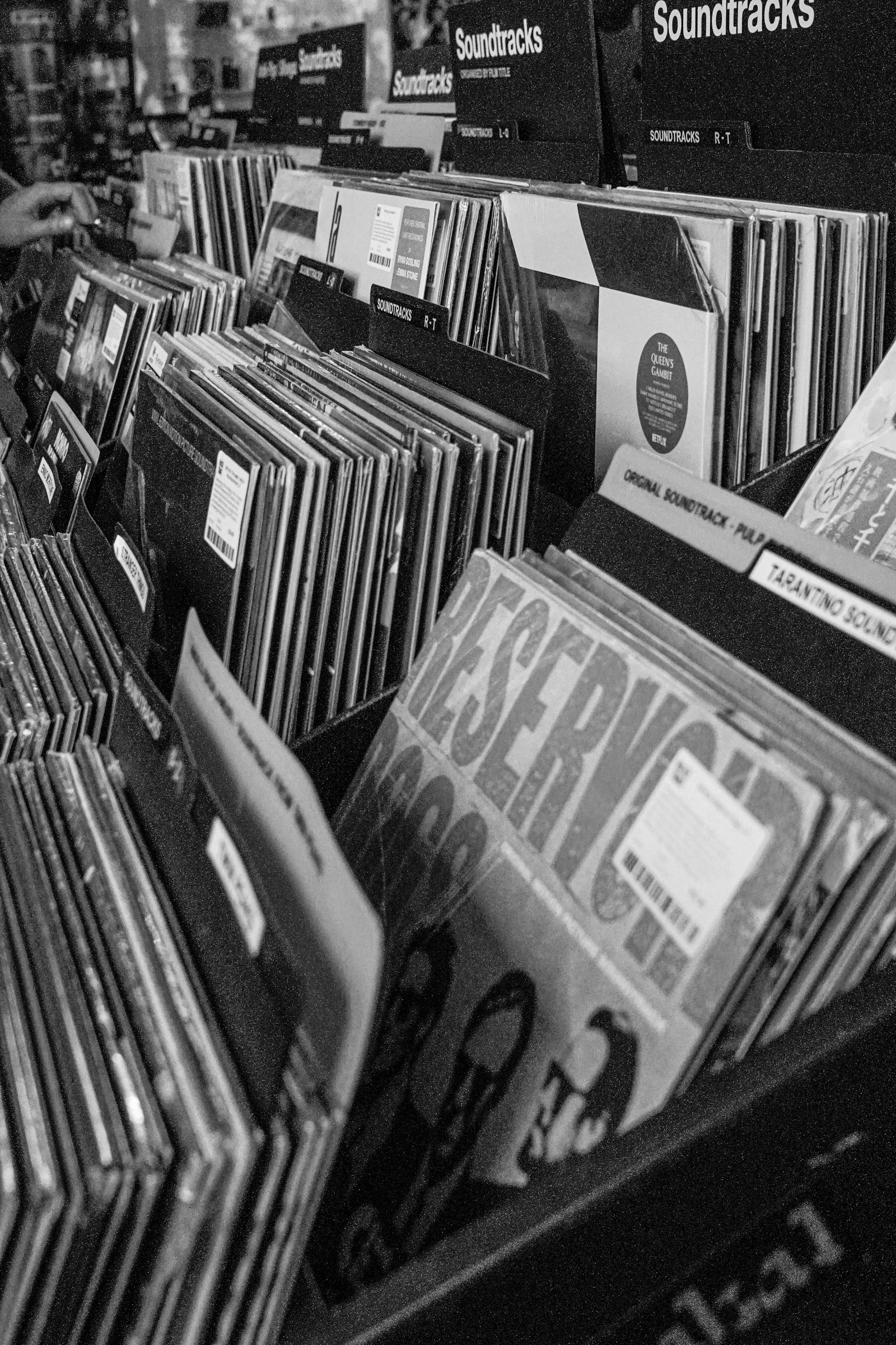 Black and white photo of a record store's soundtrack section