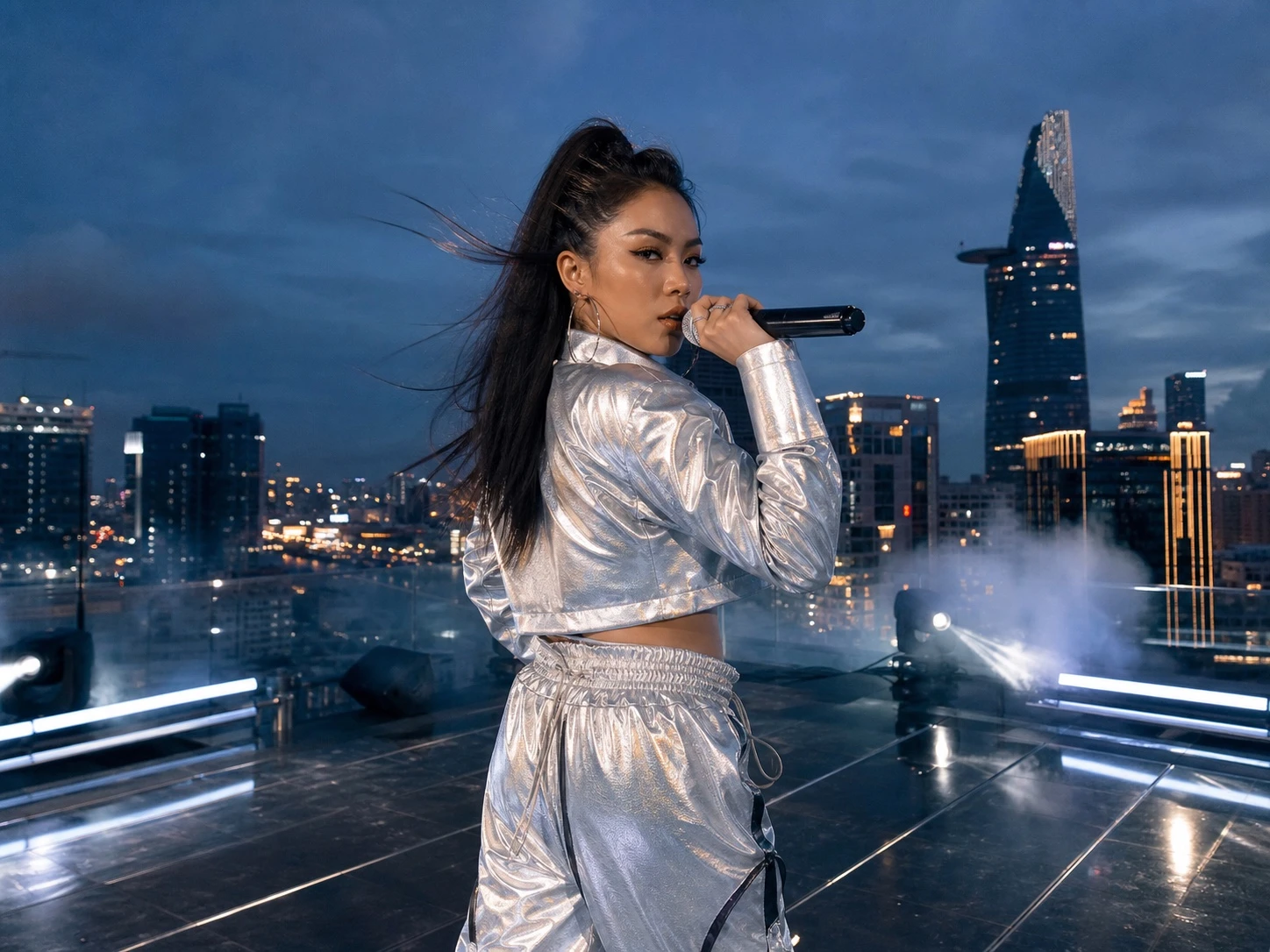 Vietnamese woman rapper performing above Ho Chi Minh City
